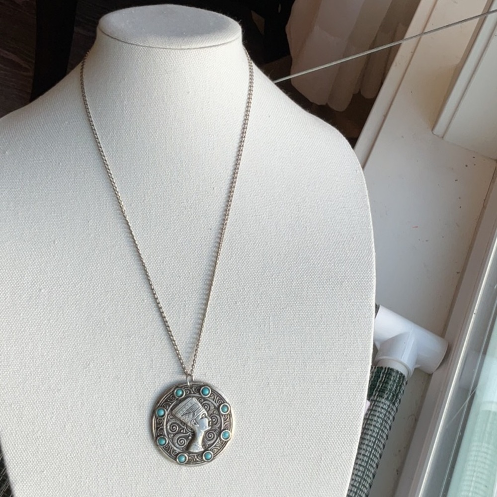 Nefertiti this necklace has aqua blue stones. I’m not sure it’s silver metal
